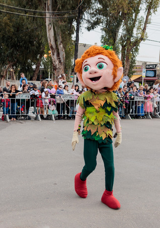 Nahariyya, Israel, March 10, 2017 : Participant in the traditional annual carnival parade "Adloyada" dressed in the suit of Peter Pan goes near the viewers and gives them a hand in Nahariyya, Israelのeditorial素材