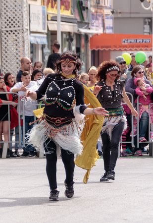Nahariyya, Israel, March 10, 2017 : Participants at the traditional annual carnival parade - dancers in exotic costume - dancing near the viewers on the street in Nahariyya, Israelのeditorial素材