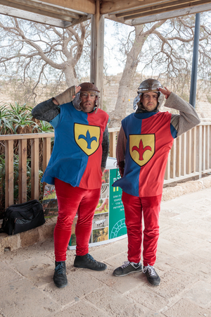 Caesarea, Israel, March 11, 2017 : Employees of the national park in Caesarea dressed in the form of heralds of the Roman times stand at the entrance to the park during the Purim celebration in Caesarea, Israelのeditorial素材