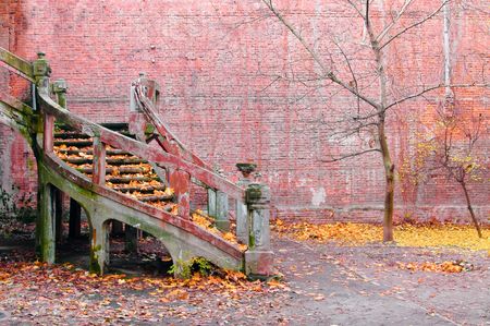 Old stairway near red brick wallの写真素材