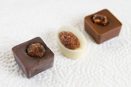 Several chocolate candies on whiteの写真素材