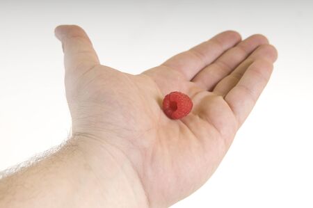 Raspberry on palm