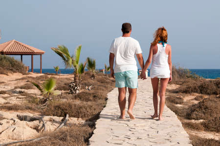 Couple walking along the seaside on Cyprus islandのeditorial素材