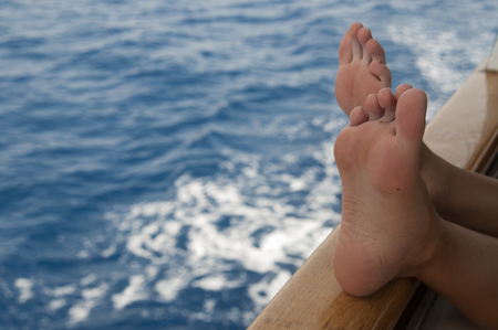 Relaxing on ship while sailing at Adriatic Seaの写真素材