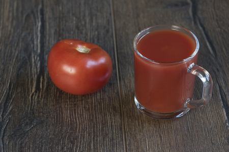 Cup of tomato juice and tomatoの写真素材