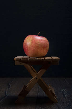 Ripe apple on a small tableの写真素材
