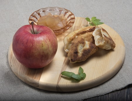 Apple theme. Ripe apple, jam, pies with jamの写真素材