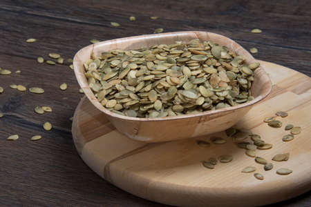 Pumpkin seeds in the bowlの写真素材