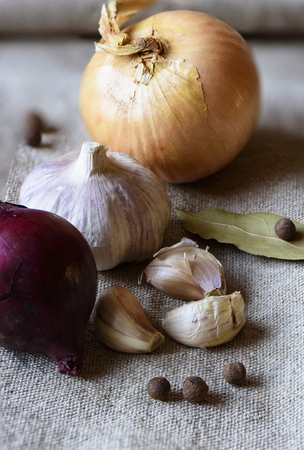 Garlic and shallots on sackcloth texture background close upの写真素材