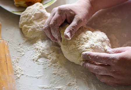 Preparation of flour dough with female hands close upの写真素材