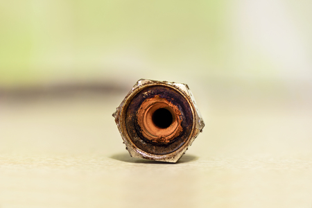 Old rusty hose socket from the kitchen sink close upの写真素材