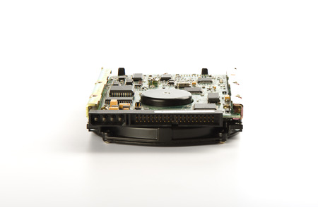 Used hard disk isolated on a white background. Dusty old hdd. Copy spaceの写真素材