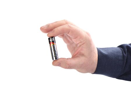 Moscow, Russia - February 3, 2019. Human hand holding Energizer AA batteryのeditorial素材