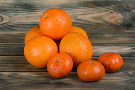 Citrus platter of oranges and mandarin on a wooden tableの写真素材