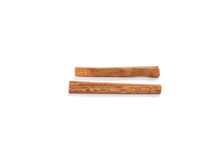 Two cinnamon sticks isolated on white background. Spice concept. Copy space