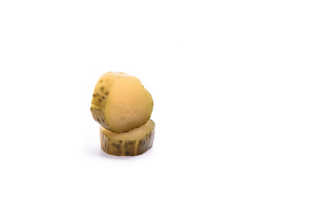 Pickled cucumber cut into slices isolated on a white background. Salting concept. Copy space.の写真素材