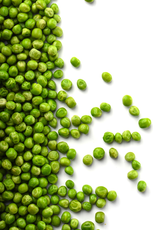 Top view. Green peas isolated on white background. Upright. Copy space.の写真素材