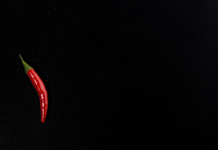 Pod of red hot pepper isolated on black color background. Copy spaceの写真素材