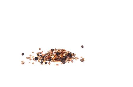 Mixture of spices for culinary mill isolated on white background. Spicy seasoning for dishes consisting of red and black peppers, garlic, mustard seeds, sea salt, paprika and coriander. Copy spaceの写真素材