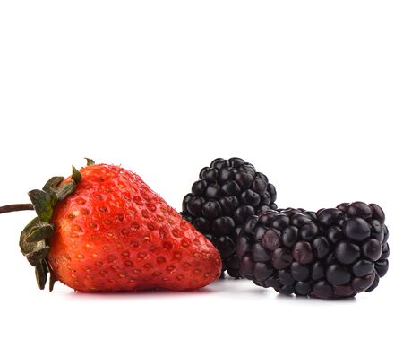 Two ripe blackberries and one strawberry over white background. Macro shot. Copy spaceの写真素材