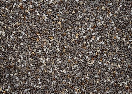 Uncooked chia seeds as a background. Top view. Close upの写真素材