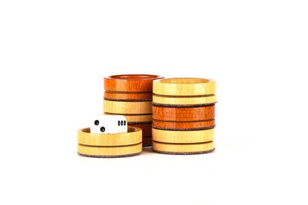Dice and backgammon checkers isolated on a white background. Copy space.