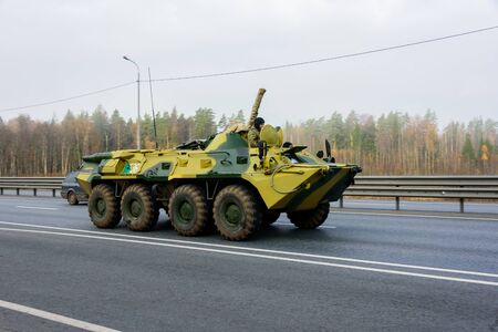 MOSCOW REGION, RUSSIA OCTOBER 19, 2019: An armored personnel carrier moves along a highway to a...