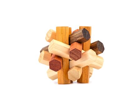 Assembled puzzle hexagon spike isolated on a white background. Wooden details connected star-shaped. Puzzle concept.の写真素材