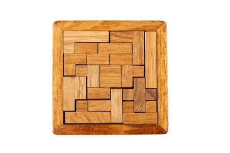 Top view. Three-dimensional wooden pentamino board game on a white background. Board games concept. Copy space.の写真素材