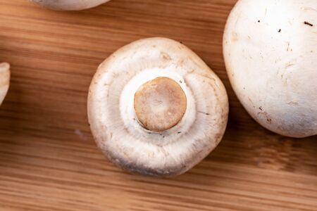 Macro shot of a slice of champignon mushroom. Rustic stile.の写真素材