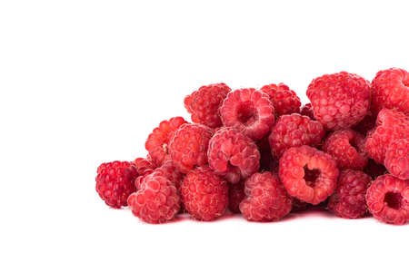 Heap of ripe raspberries isolated on white background with space for text. Close up. Border style.