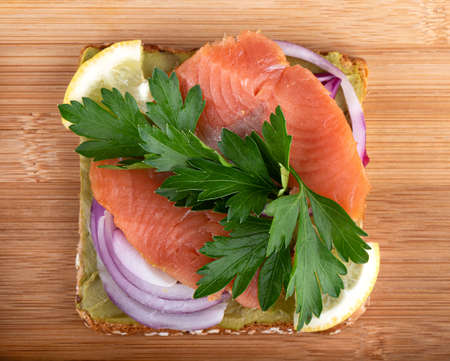 Healthy food sandwich whole grain bread on a wooden background.