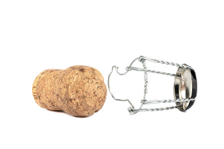 Separated champagne cork and muselet isolated on white background.の写真素材