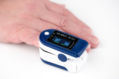 Soft focus. Measurements with a pulse oximeter on the little finger. Close up. Copy space.