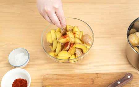 Sprinkle a wig on boiled potatoes. An option for cooking Idaho potatoes. Copy space.の写真素材