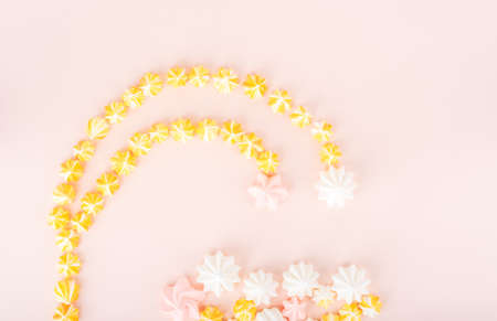 A creative layout made of sweet meringues in the form of a fireworks or a flower. Flat lay. Homemade sweets.の写真素材