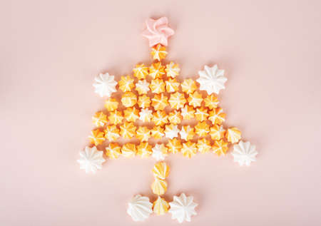 The Christmas tree is lined with sweet homemade meringues. Homemade sweets. Flat lay.の写真素材