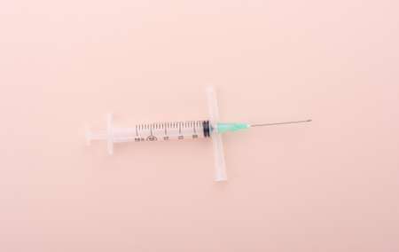 Plastic medical syringe 25 ml on the cap from the needle. Copy space.の写真素材
