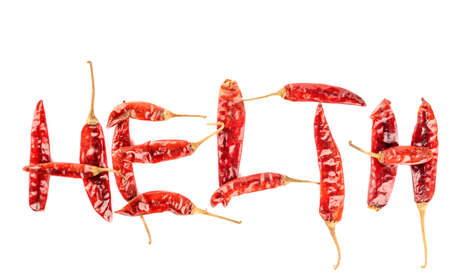 The word Helth is laid out from pungent dry pepper podsの写真素材
