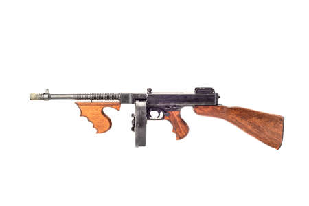 Old submachine gun of the Thompson system isolated on white background.