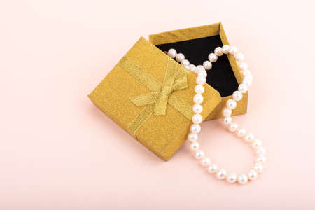 Natural pearl beads in an open gift box.の写真素材