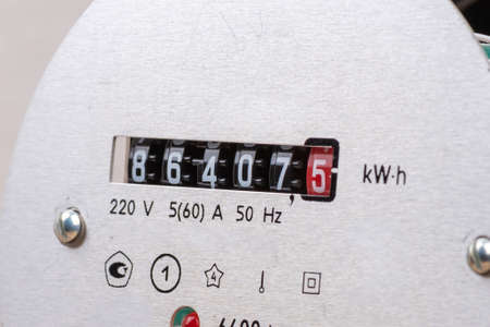 Close-up of the scale of an electric analogue meter.