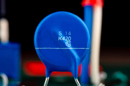 Close up of blue varistor electronic circuit board element.の写真素材
