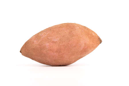 Close-up of sweet potato on a white background with place for text. Healthy food concept.の写真素材