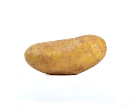 Close-up of a whole unpeeled potato on a white background. copyspace.の写真素材