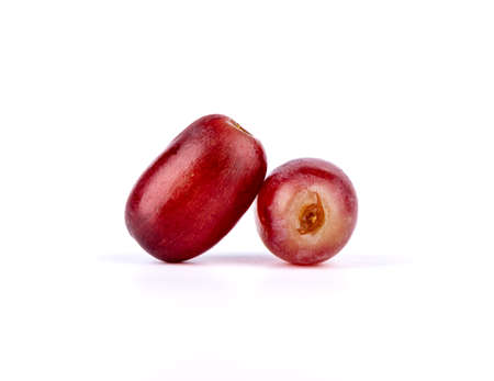 Closeup of two ripe grapes on a white background. copyspace.の写真素材
