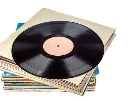 Stack of records in a package and one disc on top of the stack.の写真素材