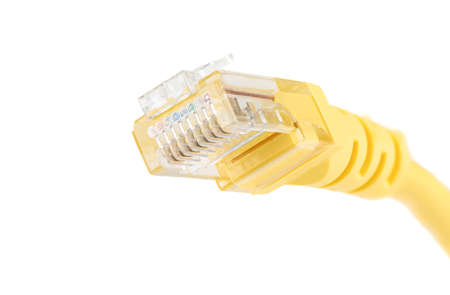 Macro shot of a yellow cable for a LAN network connection with an RJ-45 network connection plug....