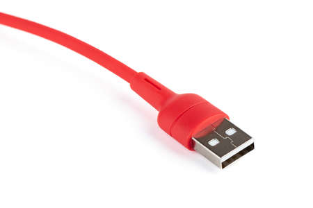 Close-up of a red USB cable on a white background. copyspace.