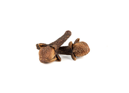 Close-up of dried unopened buds of a tropical clove tree on a white background.